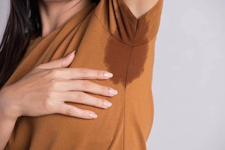 Lady suffering from sweaty underarms